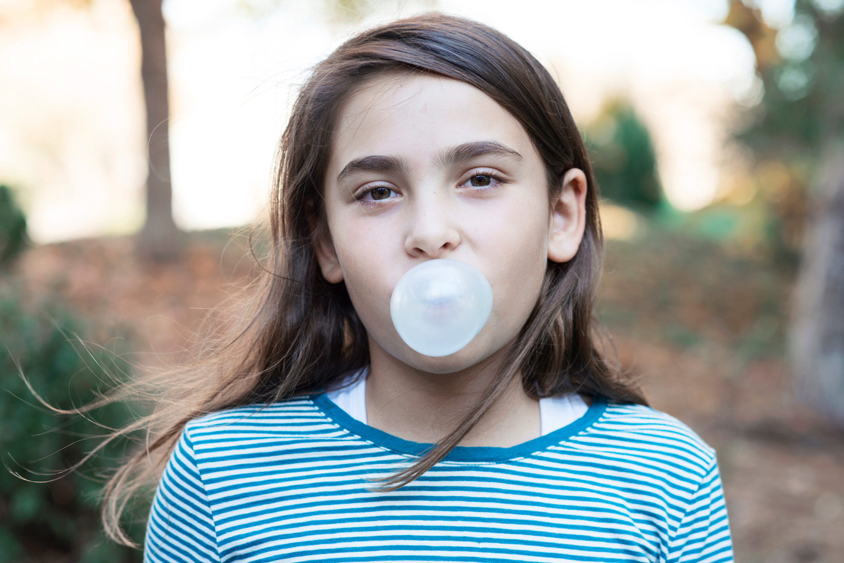 girl blowing bubble 